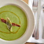 Broccoli soup topped with crispy fried pancetta and fried sage. Photo by Shea Evans