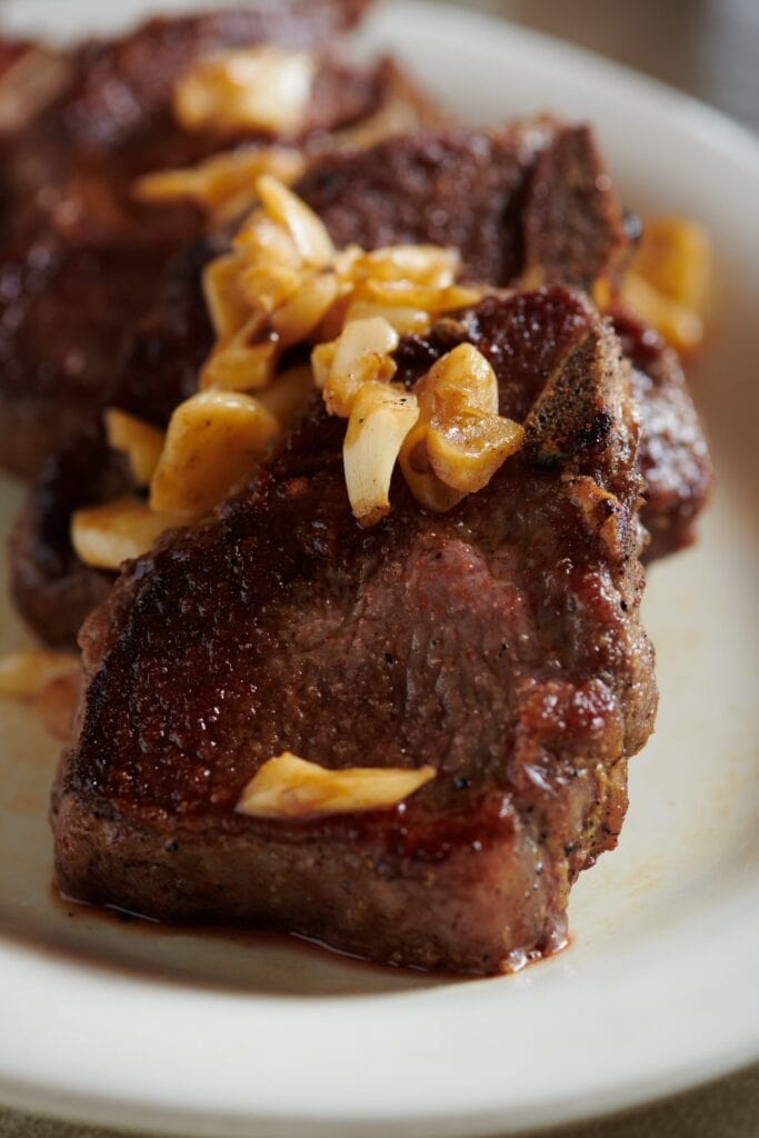 Lamb chops with garlic. Photo by Shea Evans