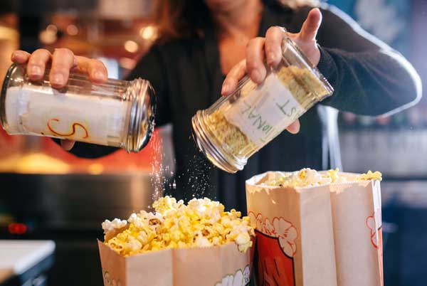The spice bar offers a variety of popcorn seasonings, including the traditional salt, pepper, and real butter, as well as up to 20 other creative options