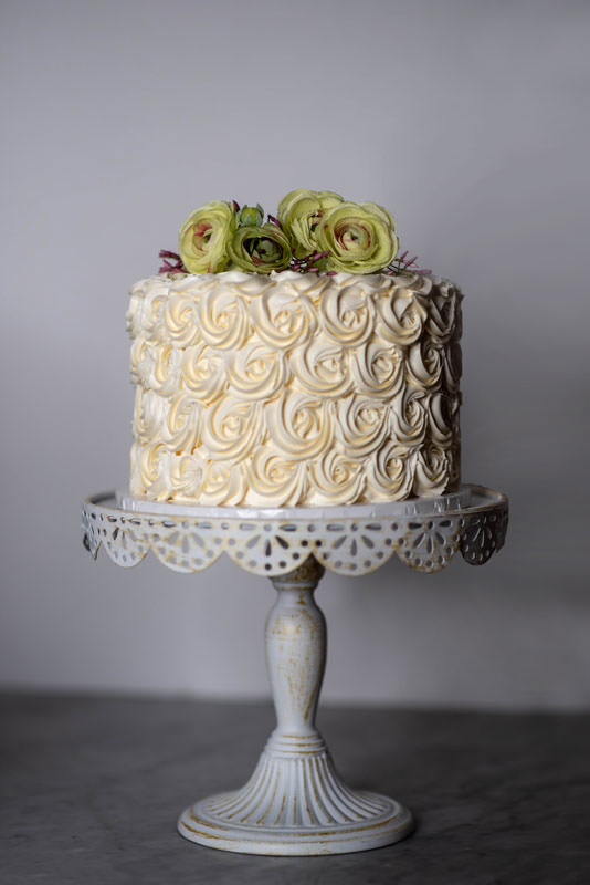 Johnson's strawberry Champagne cake on cake pedestal