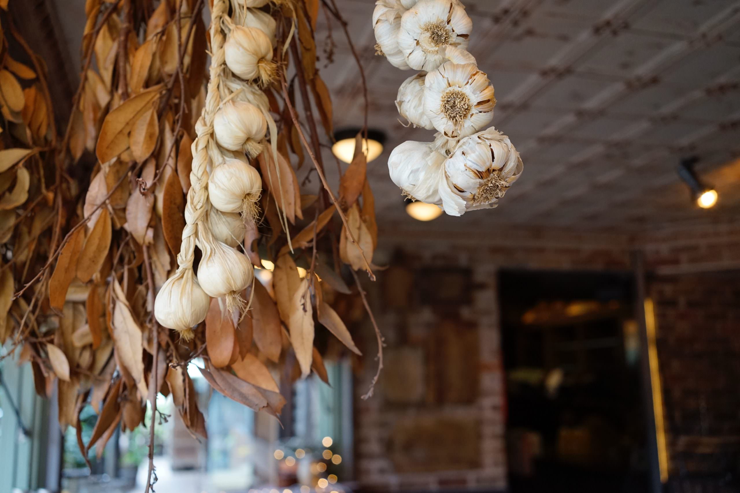 garlic braids hanging from ceiling of kitchen