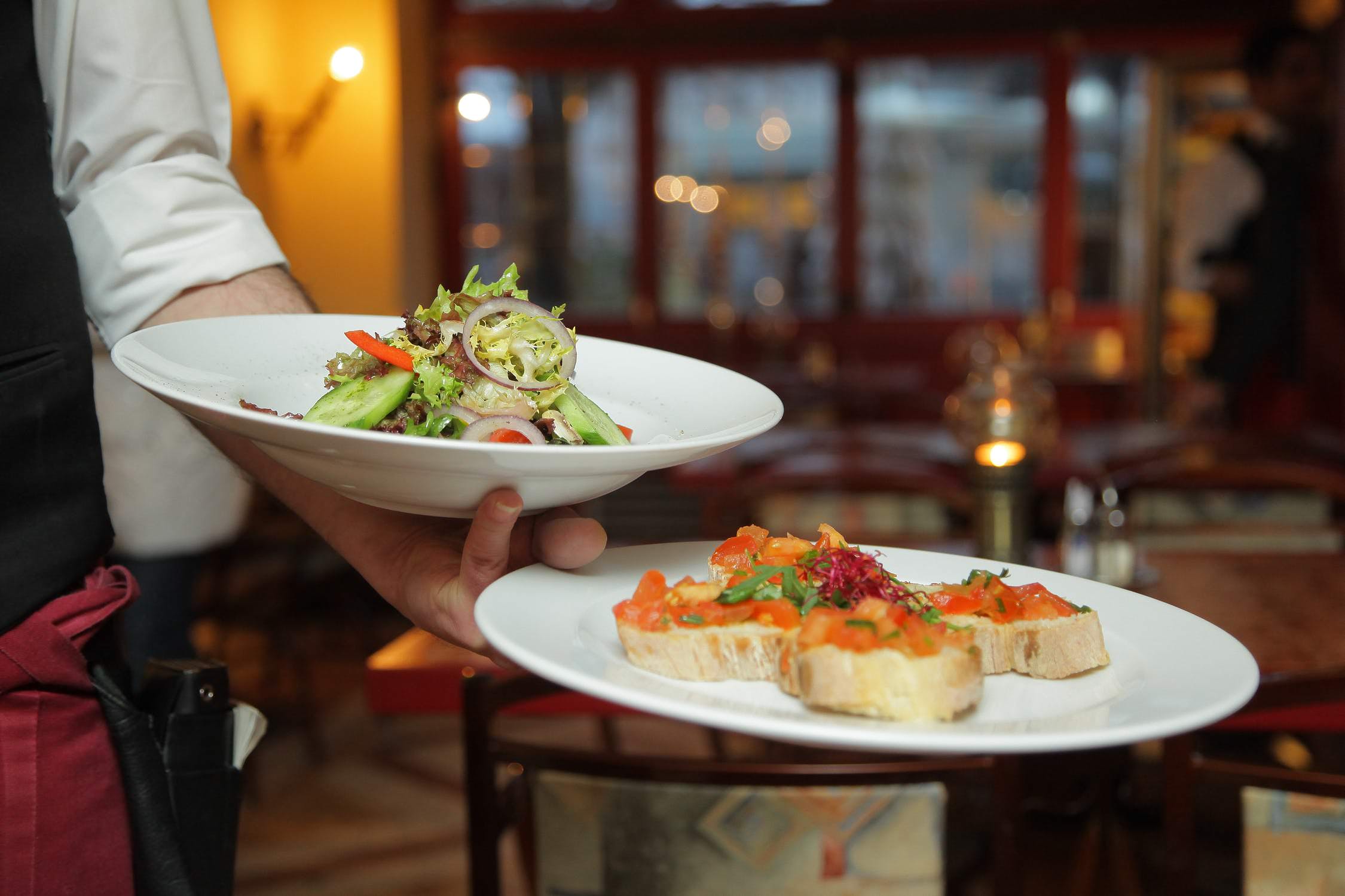 server holding two plates