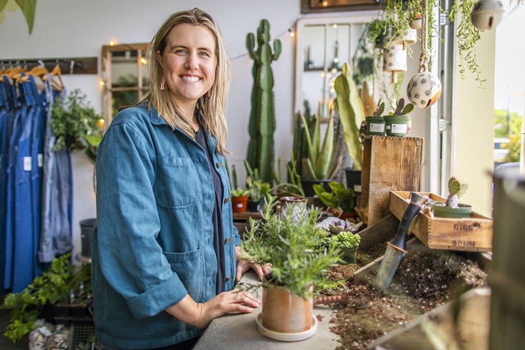 Sam Stremmel, co-owner of Reno’s Sierra Water Gardens, shows off her well-organized potting bench. Photo by Jamie Kingham