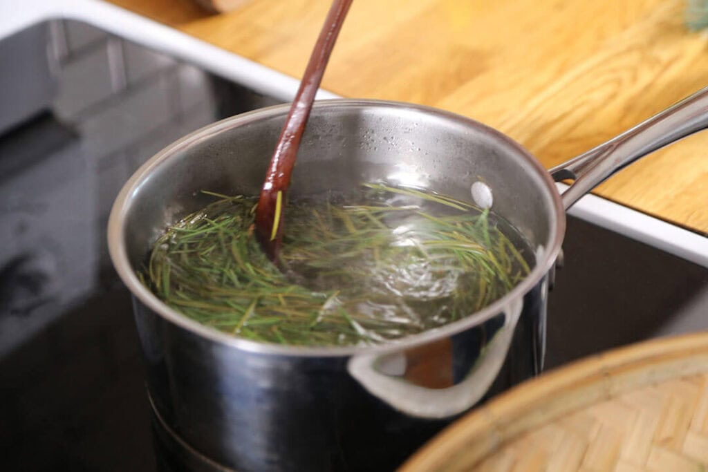 Walshaw allows the needles to steep in the simple syrup