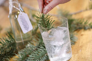 A bottle of Douglas Fir simple syrup prepared by Brooke Walshaw, with a hand stamped gift tag. Photo by Lou Manna
