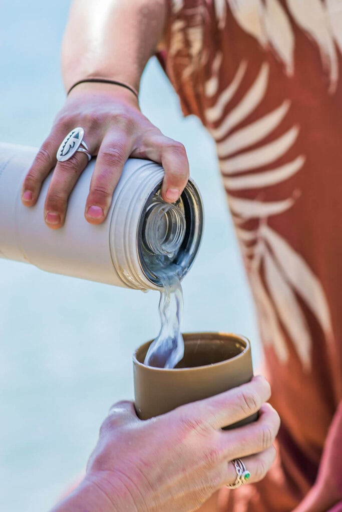The silicone sleeve can be removed and used as a cup or a makeshift dog bowl