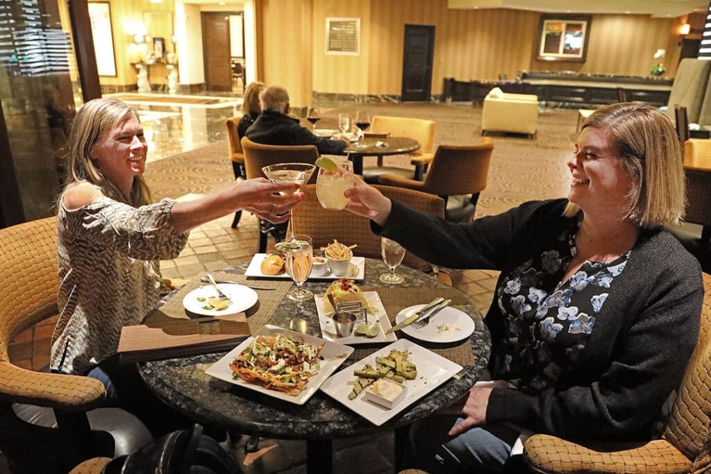 Diners at Bistro Napa enjoy half-price happy hour selections
