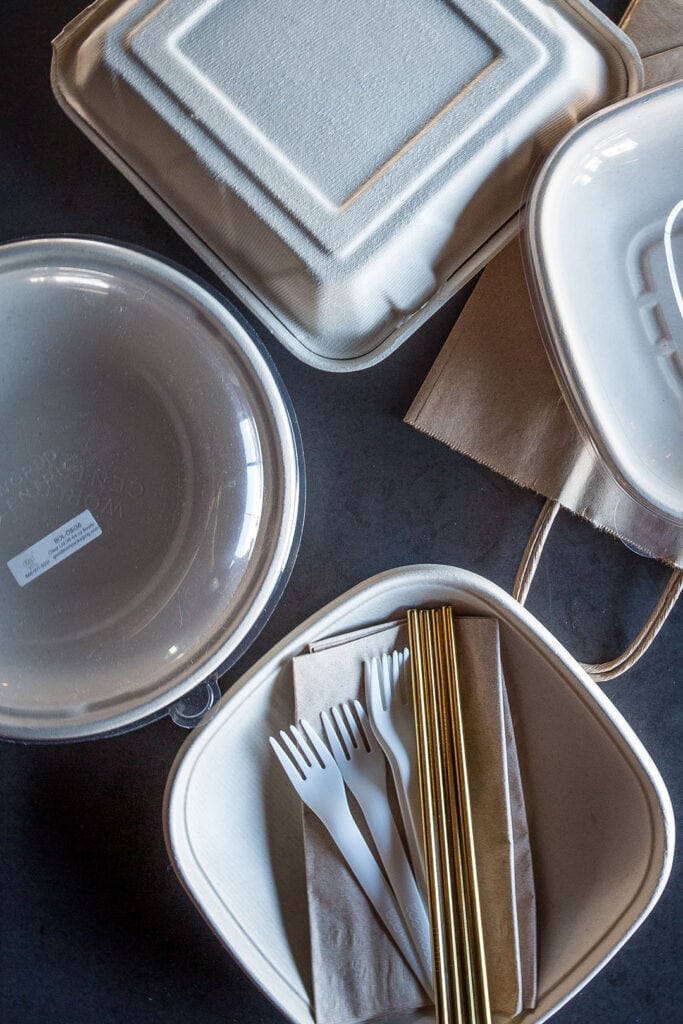 An assortment of biodegradable and compostable to go containers used by Buenos Grill