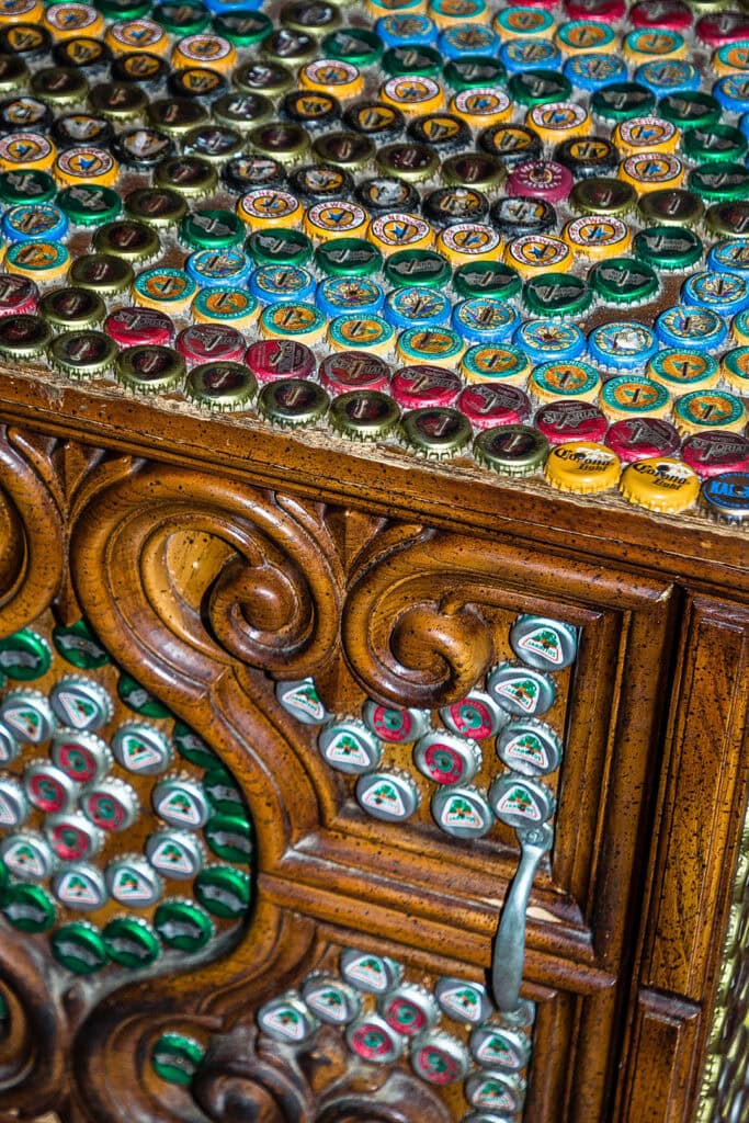 A repurposed chest is upcycled with bottle caps at Buenos Grill