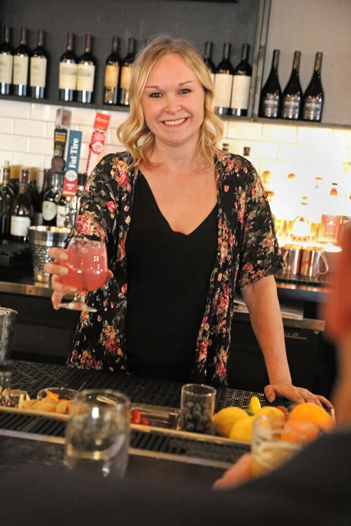 Cafe Whitney's food and beverage manager, Rebecca Childs, serves a specialty cocktail
