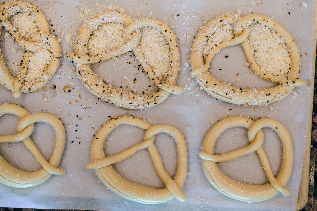 Baur sprinkles the pretzels with seasoning before baking them