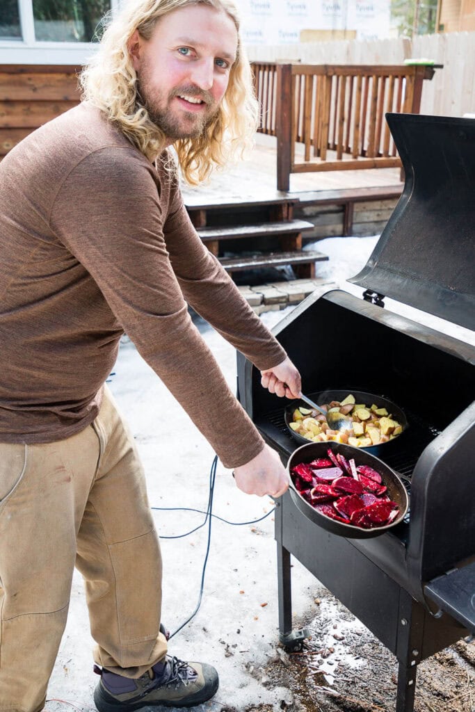South Lake Tahoe Mayor Devin Middlebrook prepares his vegan “ribs” and potatoes on the grill. Photo by Olga Miller