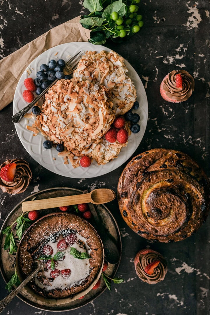Clockwise from left, Fausta Apambire’s gluten-free, vegan coconut cookies, Kathleen Pitts’ chocolate-covered strawberry cupcakes, Stephanie Papaioanu’s cinnamon raisin sourdough bread, and Eva Ruiz’s fondant au chocolate dessert