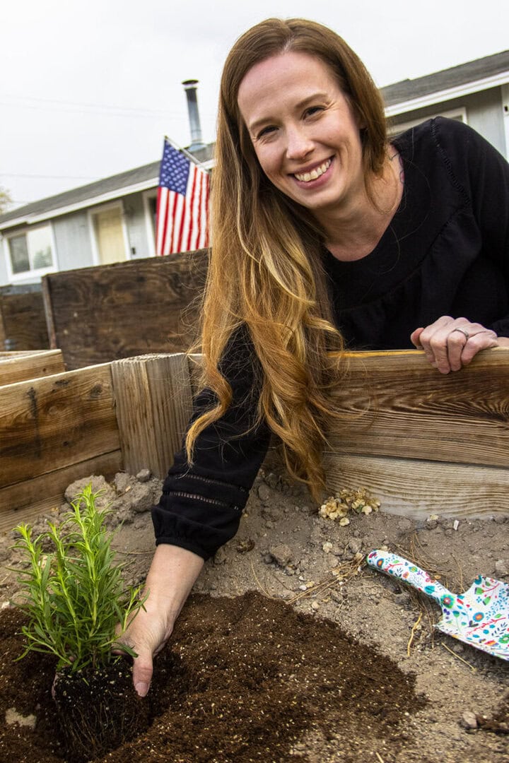 Sara Thomas works her gardening boxes
