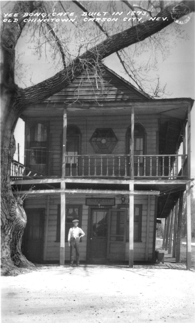 Yee Bong stands outside his café. Photo courtesy of Western Nevada Historic Postcard Collection