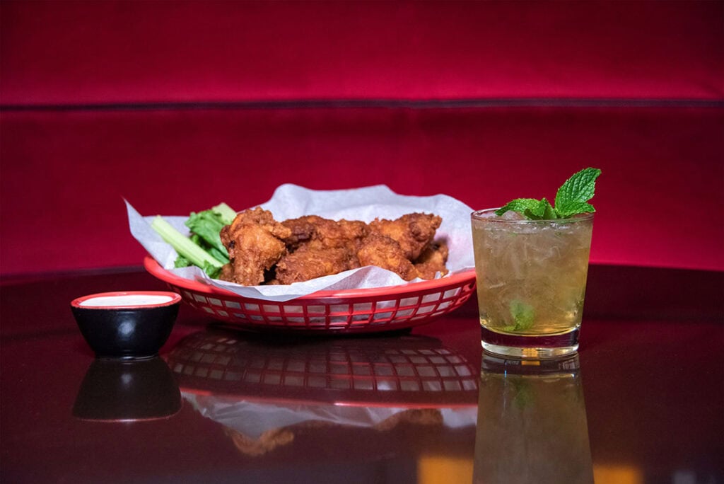 Chicken wings and a Whiskey Smash cocktail, from the bar menu