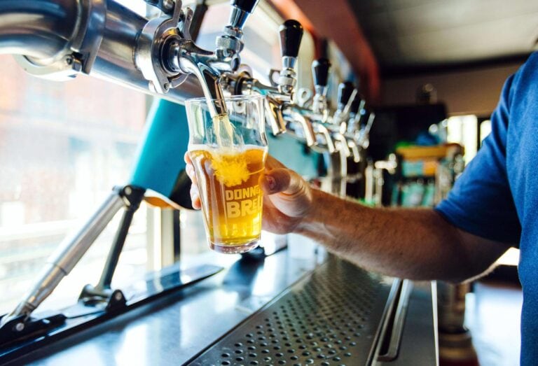 Greg Speicher pours a beer at Donner Creek Brewing in Truckee