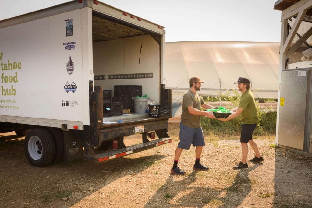 Charlie Preston-Townsend and Bryan Unger unload a delivery from Tahoe Food Hub to Reno Food Systems
