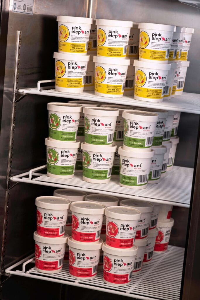 Pink Elephant sells yellow, green, and red curries, available in the storefrontโs takeout fridge
