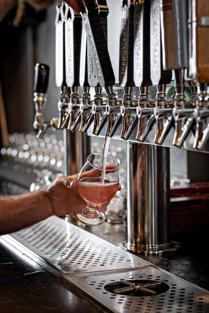 A glass of B.L. Bliss, a mead featuring flavors of blueberry and lemon, is poured at Black Rabbit Mead Co. Photo by Donna Victor 
