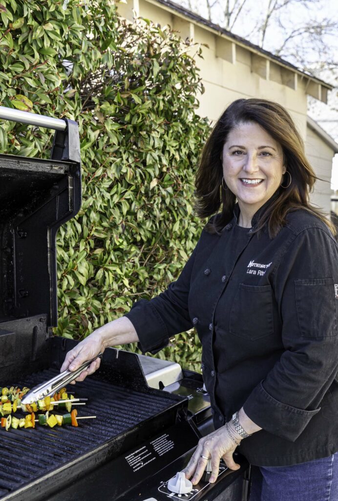 Lara Ritchie, culinary director at Nothing to It! Culinary Center in Reno, grills Mediterranean vegetable kebabs. Photo by Olga Miller