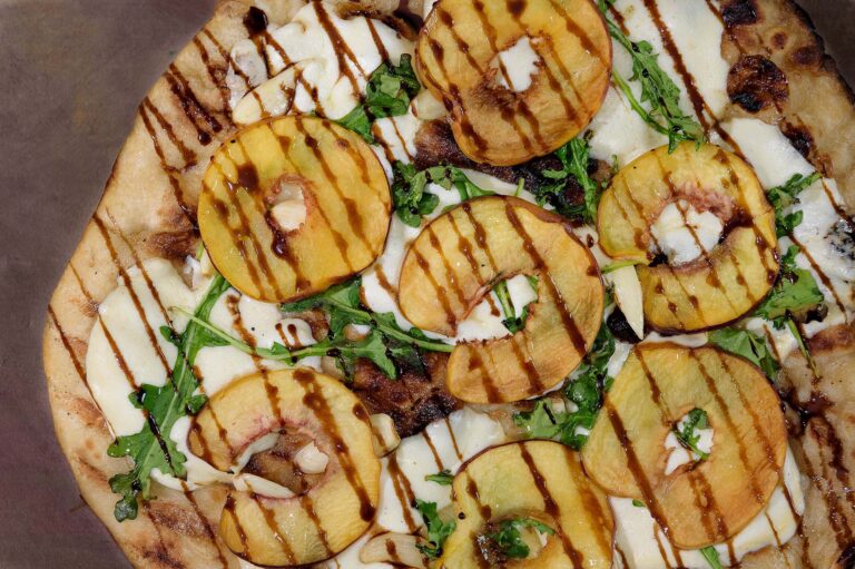 Grilled peach, burrata, and capicola pizza from Pignic Pub & Patio in Reno. Photo by Mary Claire Boucher