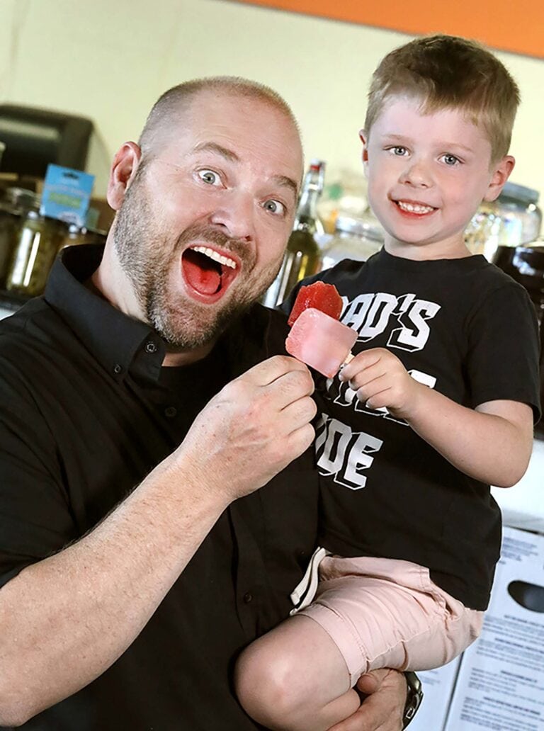 Matt Soter, founder/owner of Nevada Brining Co., and his son, Hudson, age 5, are delighted by their pickle-juice-and-cherry-Kool-Aid popsicles