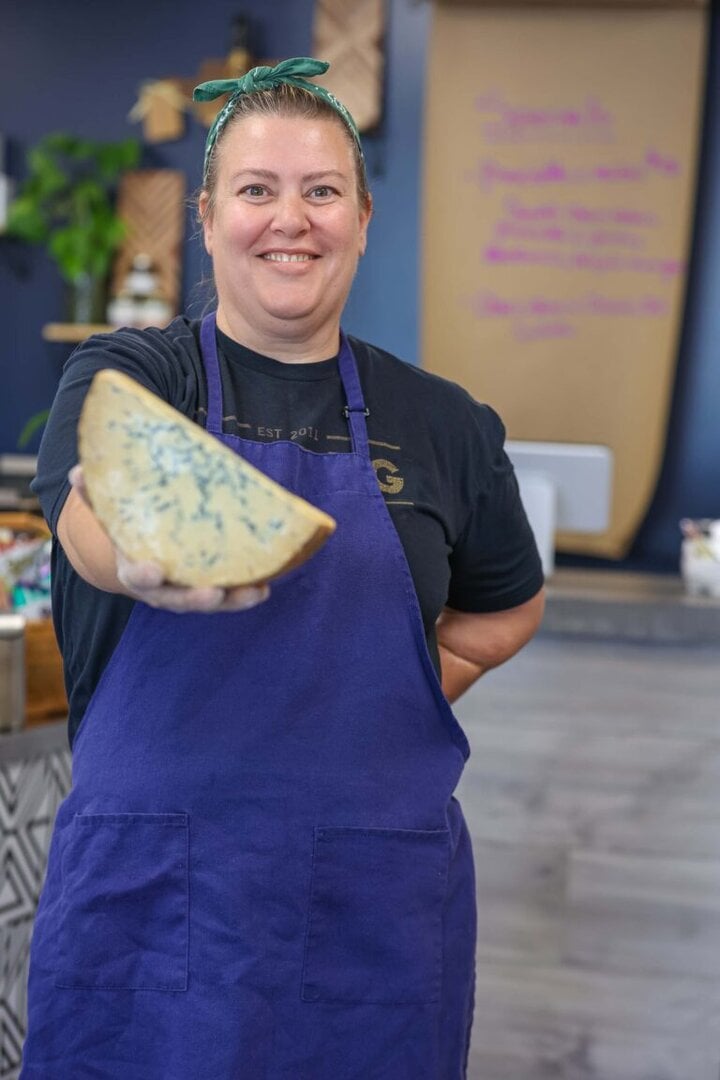 Amy Lemon, owner of The Wheyfarer Cheese and Specialty Foods in Midtown, presents a Stilton blue cheese
