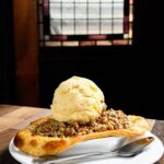 The Fox Brewery & Pub’s fruit cobbler can be filled with any fruit, such as the peach in this version. Photo by Mike Higdon