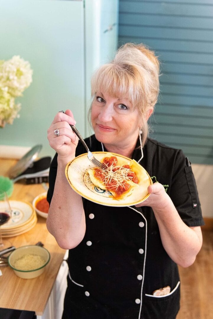 Cynthia Ferris-Bennett, owner of Sierra Chef, presents a finished vaioli dish prepared in a recent class. Photo by Mary Claire Boucher