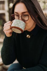 Brooke Walshaw sips fire cider. Photo by Ashley Robison