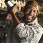 KJ Flippen, owner of The Z Bar, shakes up the makings of a cocktail before adding Champagne. Photo by Lou Manna