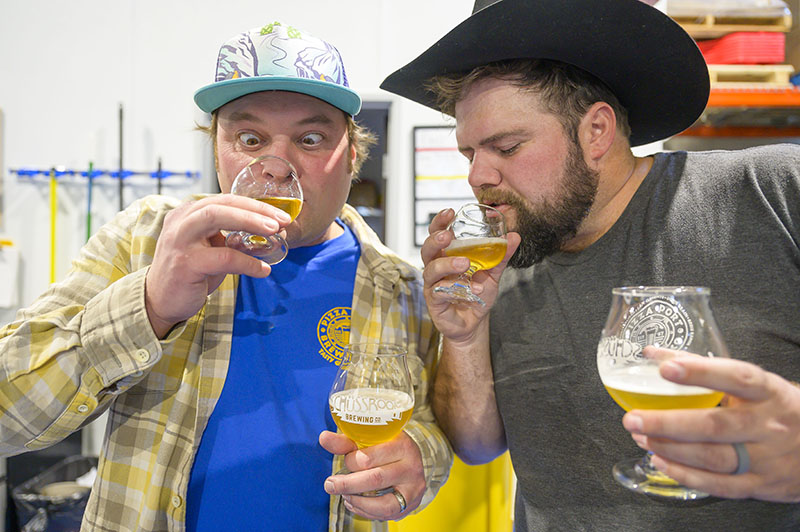 From left, Wagner of Schüssboom and Joshua Schaner, head brewer at Pizza Port Brewing Co. in Solana Beach, Calif., simultaneously sample a collaboration beer made by the two breweries.