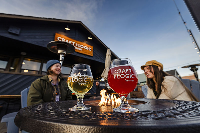 Craft & Logic’s spacious patio features cozy strings of lights, fire pits, and beautiful views of alpenglow on the surrounding mountains.