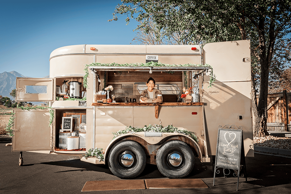 Nicole Joy serves coffee and specialty drinks from her I Love You A Latte coffee cart converted from an old horse trailer