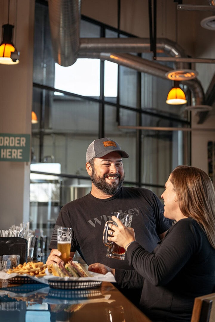 Jim and Kristy Phillips enjoy food and beer at Schüssboom Brewing Co. Photo by Donna Victor