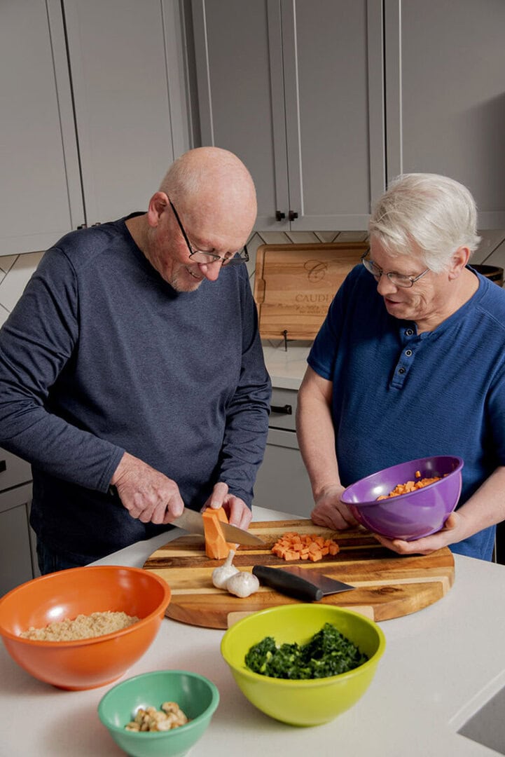From left, Randy Caudle and Joe Leberski, his son-in-law and director of dining services at Mountain Lakes Estates senior living facility in Reno, prepare quinoa kale salad