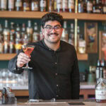 Marcos Leon serves a corpse reviver #1 at The Emerson. Photo by Shaun Hunter