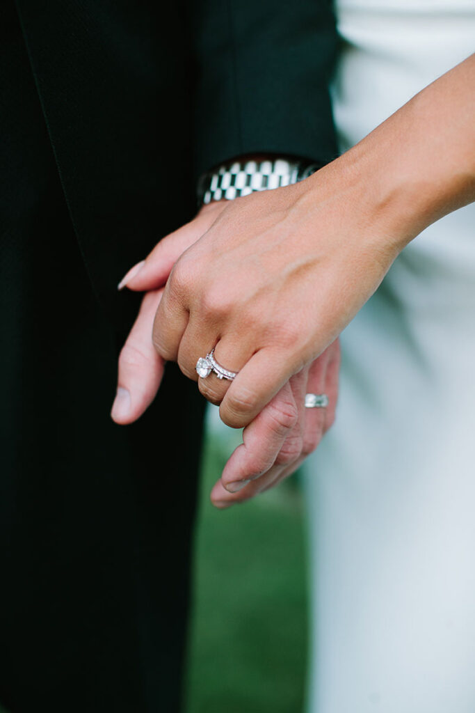 Newly married couple Taylor and Andrea Buckley hold hands after their wedding at Chalet View Lodge. Photo by Courtney Aaron