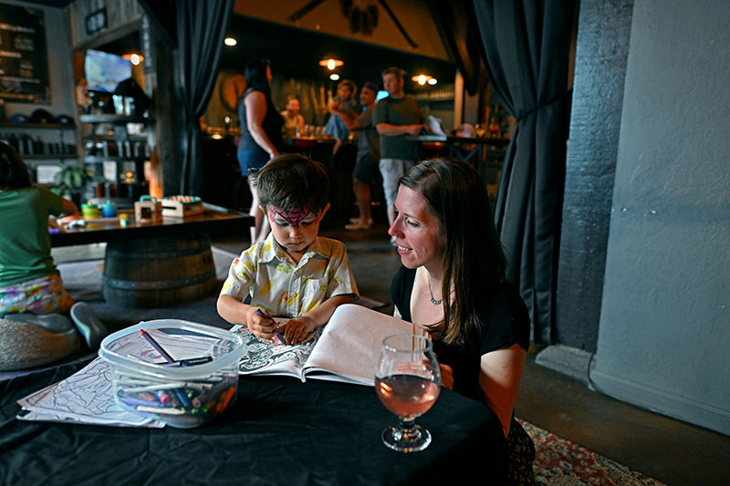 Anna Borson sits coloring with her son, August Shannon, 3, during the family-friendly folk night at Black Rabbit Mead Co. in Reno. Photo by Andy Barron