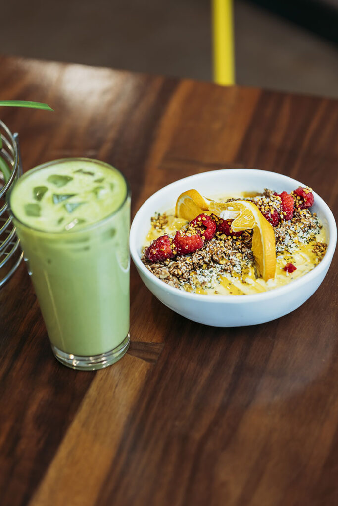 The bee’s knees sunshine bowl featuring local honey from Al Bees, with a matcha latte