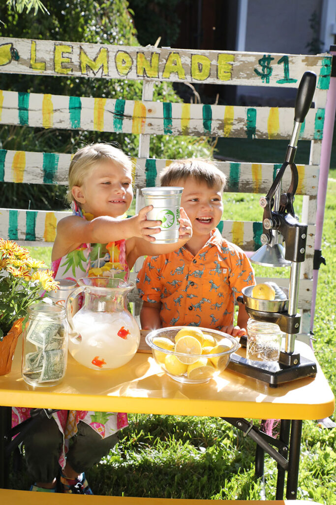 Isla and Koda Moberly at their luau-inspired lemonade stand