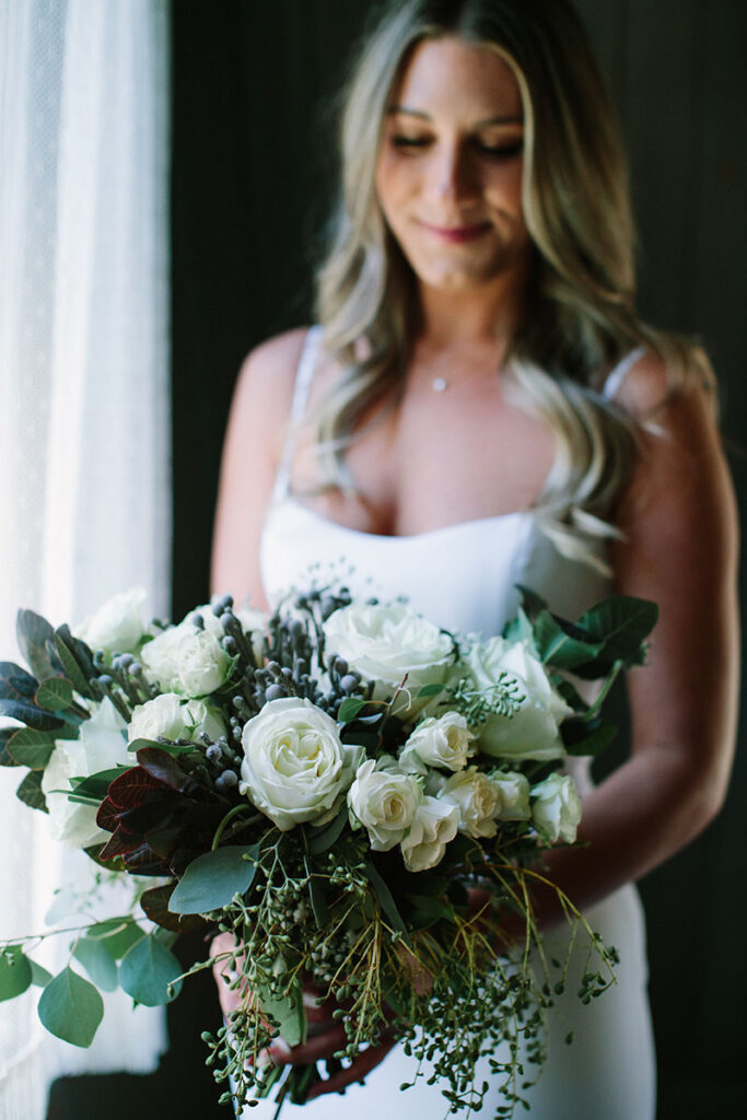 Bride Katelyn Madar prepares for her wedding at Valhalla Tahoe. Planning by Whimsy Events. Dress by Alyssa Kristen. Florals by Awesome Blossom. Hair and makeup by Lisa Pietrzak. Photo by Courtney Aaron