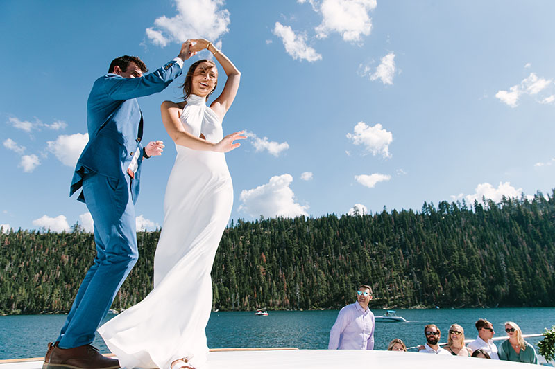 Patrick Mullane and Jen O’Neil take a spin on the Tahoe Bleu Wave boat. Dress by Jenny Yoo. Suit by Bonobos. Hair and makeup by Status Salon. Florals by Twine Floral Co. Photo by Courtney Aaron