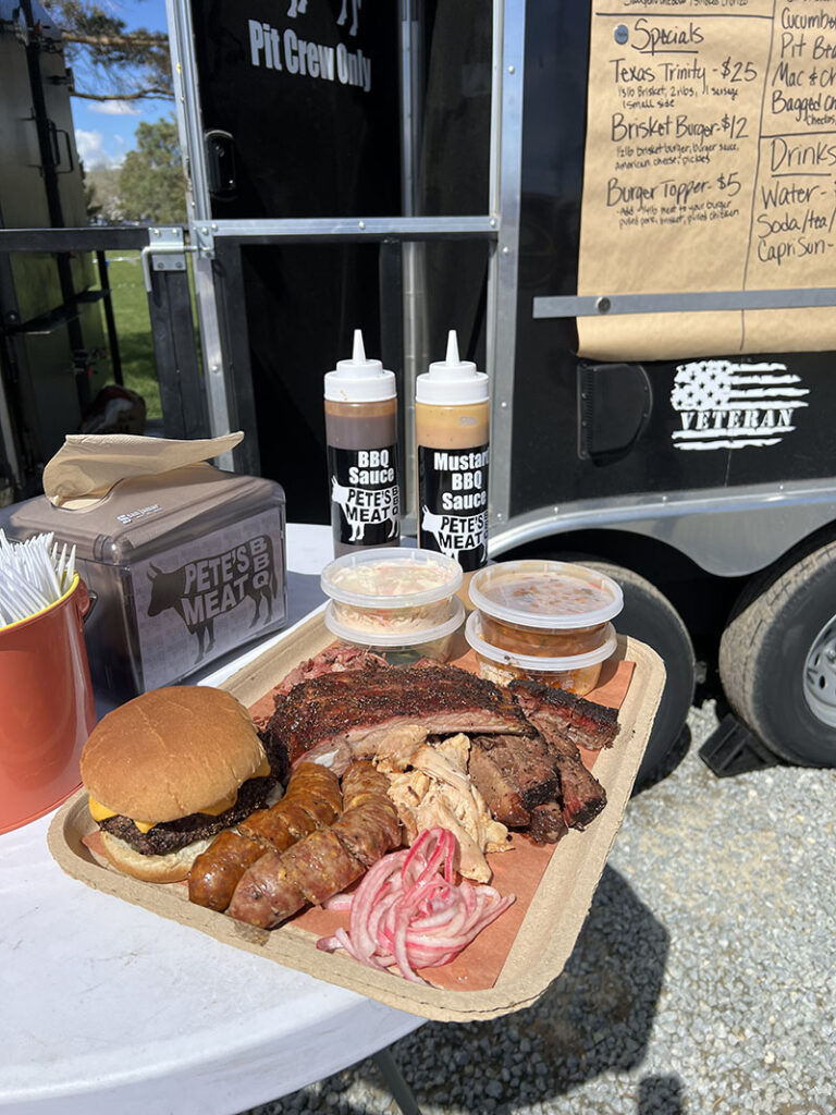 Assortment of smoked meats from Pete’s Meat BBQ, including ribs, pulled smoked chicken, burnt ends, brisket, a burger, jalapeño-Cheddar sausage and several sides. Photo by Dave Santina