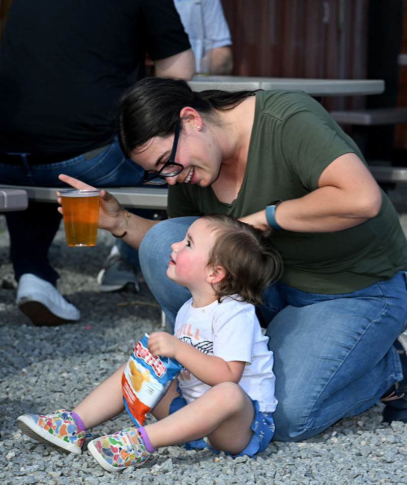 Stephanie Van Orman enjoys a cold drink and snack with daughter Norah, 2, at Shoe Tree Brewing Co. in Carson City. Photo by Andy Barron