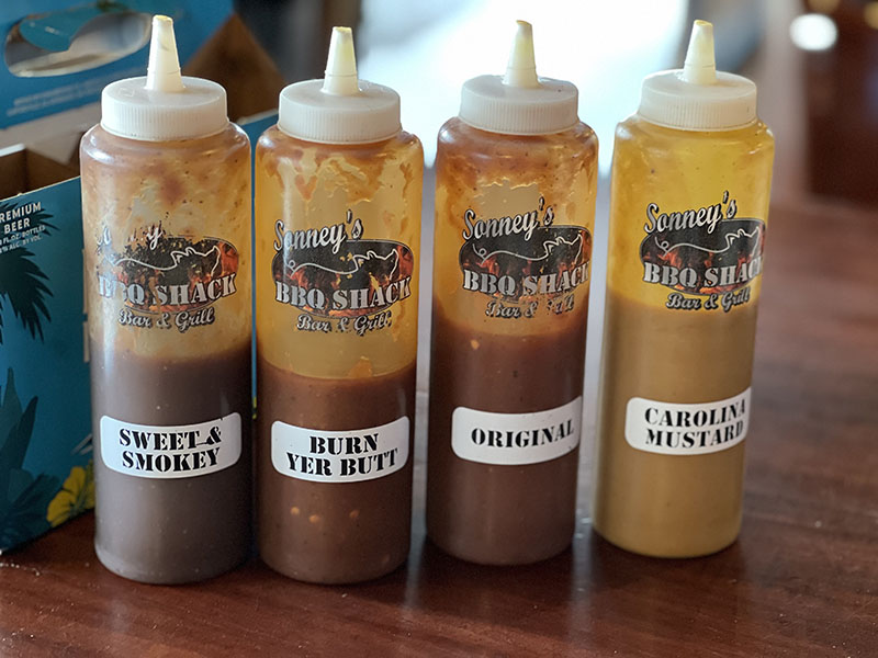 Sonney’s BBQ Shack offers a selection of sauces to suit any preference. Photo by Dave Santina