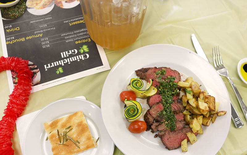 At Douglas High School’s 2024 Best Restaurant Competition, Team Argentina served a decadent meal in its Chimichurri Grill, the eatery that students conceptualized. They sourced and cooked the food, crafted menus, and decorated the space. Photo courtesy of Douglas County School District