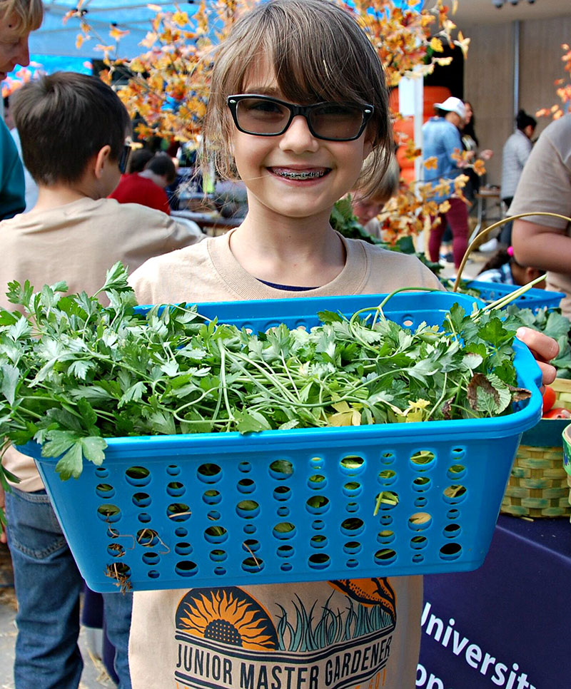 A student “farmpreneur” at one of Green Our Planet’s biannual Giant Student Farmers’ Markets in Southern Nevada. Photo courtesy of Green Our Planet