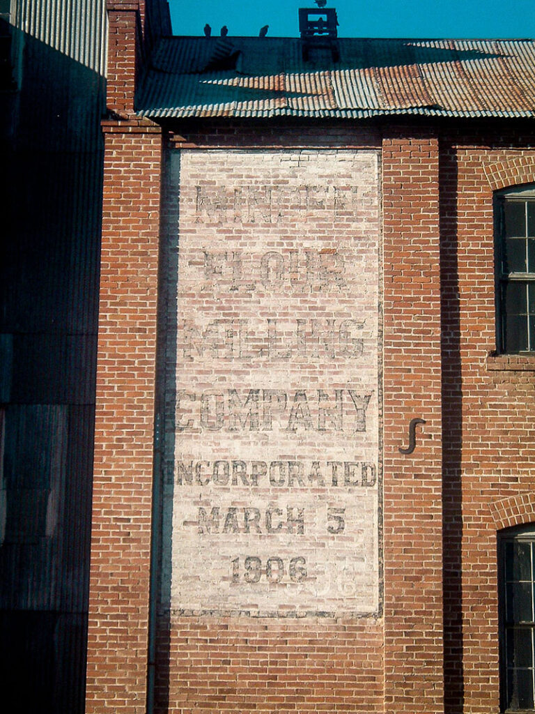 Look carefully and you’ll see old lettering on the brick that reveals the building’s past as a flour mill. Photo courtesy of Scott Schrantz